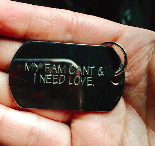 hand-holding-dog-tag-2